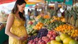 © Adel - Pregnant woman shopping for healthy food at farmers market for prenatal nutrition and vitamins diet