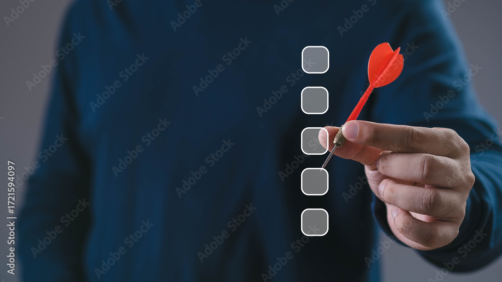 Businessman holding red dart aiming at checklist boxes, concept of ...