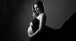 © Langit - Elegant black and white maternity portrait capturing the serene beauty and anticipation of an expectant mother embracing her baby bump, symbolizing new beginnings and motherhood