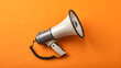 © Ema - White megaphone on orange background