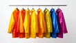 © peni - Bright colorful raincoats hanging on a clothing rack