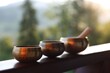 © New Africa - Tibetan singing bowls with mallet on handrail outdoors, closeup