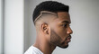 © Lilufa - Stylish african american man with a modern haircut and beard, showcasing a clean and fashionable look