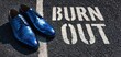 The Blue Shoes on Burn Out Asphalt Creating a Striking Street Scene
