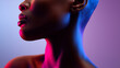 © dinatychynska - Powerful portrait of confident African woman in dramatic neon lighting. Beautiful profile with pink and blue gradient colors, empowerment concept. Fashion beauty photography with vibrant style.