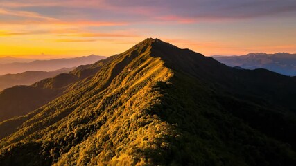 Wall Mural - Sublime timelapse of golden hour light sweeping across a vibrant lush green mountain peak at sunset environment, highland, sunset