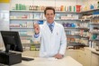 © Zabi - Pharmacist holding a credit card in front of shelves filled with medicines in a pharmacy setting