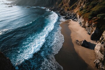Wall Mural - View of wild beach and ocean waves from above showcasing rocky shoreline and soft sands during sunny weather