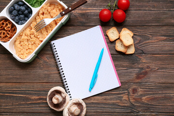 Wall Mural - Healthy products and notebook on wooden background. Diet concept