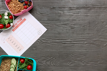 Wall Mural - Healthy products and weekly meal plan on wooden background. Diet concept