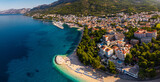 Beautiful Adriatic coastline featuring the town of Baska Voda with its turquoise water beach and bustling marina
