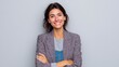 © pinporn manosri - Confident young woman in stylish attire with light brown hair smiling at the camera against a neutral background, showcasing a professional and approachable demeanor.