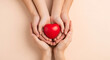© zahra - Family hands holding red heart, health care, hope, life insurance concept, world heart day, world health day, adoption foster care home, organ donor day, csr social responsibility, gratitude