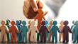© Chiam - Adapt leadership style to meet the needs concept. Diverse figurines represent teamwork and collaboration concepts.