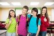 © BillionPhotos.com - School kids standing with books and schoolbag