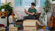 © itchaznong - Moving Day. Couple unpacking boxes and enjoying moments in new home.