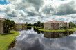 Family houses with retention ponds to prevent flooding in Florida closed suburban area. Real estate development in American suburbs