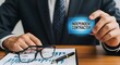 © MdNazim - Person holding independent contractor card business