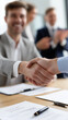 © Curioso.Photography - Businessmen shaking hands after successful meeting in office.