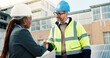 © peopleimages.com - Solar panel, engineer or handshake with partnership outdoor for PV installation, project deal or team. Technician, people and shaking hands on rooftop for renewable energy and sustainable maintenance