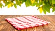 © tukang - Red checkered cloth on wooden table, blurry lemon tree background