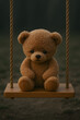 © Ram - Sad teddy bear sitting alone on wooden swing outdoors, emotional toy photography, loneliness childhood symbol, melancholic mood, stuffed animal close up in soft light