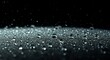 © Cmoso - Close-up of water droplets on a dark surface with a black background and falling rain droplets, creating a glossy reflective effect with a sense of moisture and rain atmosphere