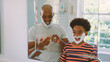 © Monkey Business - Father And Son At Home Having Fun Playing With Shaving Foam In Bathroom Making A Mess Together