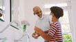 © Monkey Business - Father And Son At Home Having Fun Playing With Shaving Foam In Bathroom Making A Mess Together