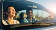 © Sejjil - Joyful couple laughing together while driving on a sunny day road trip adventure