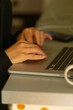 © Alena - A detailed closeup of hands actively typing on a laptop keyboard situated on a neatly organized desk, clearly indicating themes like work, productivity, or engaged digital interaction
