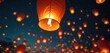 © miss irine - Glowing paper lanterns float in dark night sky during festival celebration. Warm orange lights illuminate scene. Tradition, culture, event atmosphere, wishes release. Community, holiday, gathering,