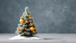 © pinporn manosri - Beautifully Decorated Christmas Tree with Ornaments and Soft Snowy Base Against a Gray Background Perfect for Holiday-Themed Design Projects and Festive Promotions