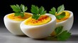 Three beautifully presented deviled eggs garnished with fresh parsley and sprinkled with paprika, showcasing vibrant yellow filling and smooth white egg halves, perfect for culinary presentations and 
