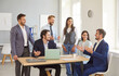 © Studio Romantic - Young confident happy smiling people group of company employees talking on business meeting sitting in modern office during a conference, discussing new job projects or startups. Teamwork concept.
