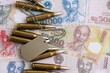 © mehaniq41 - Vietnamese dong currency money bills and rifle bullets with dogtag close up. The concept of warfare and army service