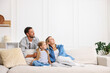 © New Africa - Happy family spending time together at home. Space for text