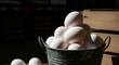 © Asha - A close up shot of a metal bucket filled with many freshly laid eggs