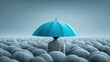 © PixelCrafted - Person with a blue umbrella stands out in a crowd of gray umbrellas.