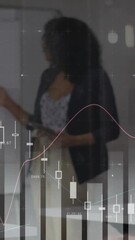 Wall Mural - Animation of data processing and diagrams over diverse colleagues talking in office