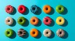 © Shutter Wisp - Colorful variety of frosted doughnuts arranged in rows on a bright blue background