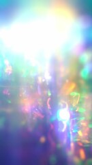Wall Mural - A gradient of rainbow hues melted into an iridescent glow, forming a blurred abstract background with shimmering bokeh