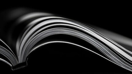 Wall Mural - book is open to a page with a black background. the book is a hardcover and the pages are white