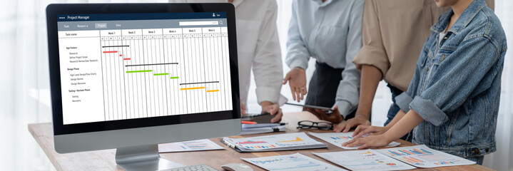 Wall Mural - Project planning software for brisk business project management on the computer screen showing timeline chart of the team project
