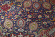 © Alene Photographs - Detail of persian carpet macro: floral blue and red pattern texture