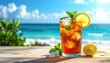 © neon - Refreshing iced tea, brimming with ice, lemon, and mint, sits on a wooden surface with a tropical beach background under sunny skies