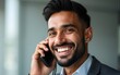 © li - Happy smiling mid adult indian businessman on call. High quality