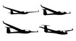 © Sazid - Set of four distinct glider aircraft silhouettes in dynamic flight poses vector