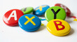 © Fahadi - Colorful abxy buttons for gaming console controller replacement parts close up macro photography