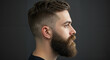 © Tamaras Pictures 4U - Young man with beard and stylish haircut posing against dark background
